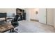 Comfortable office featuring carpet flooring and a modern work setup, with a book case and view of the doorway at 4929 Dufour Dr, Lilburn, GA 30047