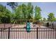 Fenced playground area with swings, a slide, and climbing features is a fun community amenity at 4929 Dufour Dr, Lilburn, GA 30047