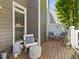 Wood deck with outdoor seating, privacy screen, and potted plants, perfect for relaxing at 7 Nesbit Pl, Alpharetta, GA 30022