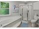 Bathroom featuring a glass shower enclosure, toilet, vanity, and a soaking tub at 7 Nesbit Pl, Alpharetta, GA 30022
