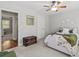 Comfortable bedroom with carpet flooring, ceiling fan, and an antique chest at 7 Nesbit Pl, Alpharetta, GA 30022
