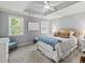 Comfortable bedroom with a tray ceiling and bright natural light at 7 Nesbit Pl, Alpharetta, GA 30022