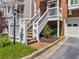 Elevated entryway featuring white railings and a one car garage at 7 Nesbit Pl, Alpharetta, GA 30022