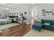 Open concept living room boasts hardwood floors, bright natural light and work station at 7 Nesbit Pl, Alpharetta, GA 30022