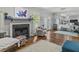 Open concept living room with hardwood floors, fireplace and natural light at 7 Nesbit Pl, Alpharetta, GA 30022
