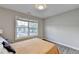 This bedroom features a large window, allowing for lots of natural light to come in the room at 801 Old Peachtree Nw Rd # 56, Lawrenceville, GA 30043