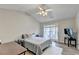 This bedroom features wood-look floors and a ceiling fan at 801 Old Peachtree Nw Rd # 56, Lawrenceville, GA 30043