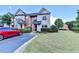 Charming townhome with well-maintained landscaping and a neat, paved parking area at 801 Old Peachtree Nw Rd # 56, Lawrenceville, GA 30043
