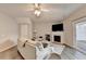 Comfortable living room with a fireplace and a sliding door to the patio at 801 Old Peachtree Nw Rd # 56, Lawrenceville, GA 30043