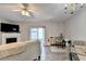 A cozy living room featuring a fireplace, eating nook and access to the patio at 801 Old Peachtree Nw Rd # 56, Lawrenceville, GA 30043