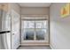 A well lit window with blinds overlooks the landscaped exterior at 801 Old Peachtree Nw Rd # 56, Lawrenceville, GA 30043