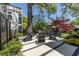 Backyard patio with modern seating and meticulously landscaped garden areas at 1076 Manigault Se St, Atlanta, GA 30316