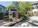 Backyard view featuring a custom playhouse with pink door and stylish outdoor seating at 1076 Manigault Se St, Atlanta, GA 30316