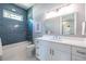 Bathroom with a large vanity, a large mirror and a shower with a tiled wall at 1076 Manigault Se St, Atlanta, GA 30316