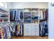 Spacious walk-in closet with custom shelving, hanging rods and drawers to keep all of your clothing and accessories organized at 1076 Manigault Se St, Atlanta, GA 30316