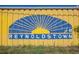 Community mural of Reynoldstown with a blue and yellow sunburst design at 1076 Manigault Se St, Atlanta, GA 30316