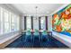 Chic dining room with a stylish table, modern chairs, and artwork at 1076 Manigault Se St, Atlanta, GA 30316
