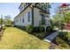 Exterior view of the home highlighting its manicured lawn and landscaped path at 1076 Manigault Se St, Atlanta, GA 30316
