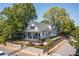 Stylish two-story home showcasing a manicured lawn and sophisticated landscaping at 1076 Manigault Se St, Atlanta, GA 30316