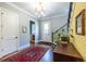 Traditional home foyer with hardwood floors, staircase, rug and a bunny painting on the wall at 1076 Manigault Se St, Atlanta, GA 30316
