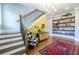 Foyer featuring staircase, accent wall, stylish decor and hardwood flooring at 1076 Manigault Se St, Atlanta, GA 30316