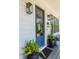 Stylish front entrance with a charming blue door and elegant lighting fixtures at 1076 Manigault Se St, Atlanta, GA 30316