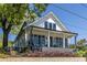 Inviting two-story home with a covered front porch and beautifully landscaped front yard at 1076 Manigault Se St, Atlanta, GA 30316