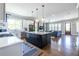Open-concept kitchen with a large island and stainless steel appliances, seamlessly connected to the living area at 1076 Manigault Se St, Atlanta, GA 30316