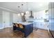 Modern kitchen features a center island with bar seating and sleek appliances at 1076 Manigault Se St, Atlanta, GA 30316