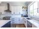 Modern kitchen featuring white cabinetry, stainless steel appliances, and a view of the backyard at 1076 Manigault Se St, Atlanta, GA 30316