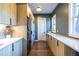 Laundry room with washer and dryer and long counter with many cabinets at 1076 Manigault Se St, Atlanta, GA 30316