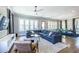 Inviting living room featuring a comfortable sectional sofa, hardwood floors, and ample natural light at 1076 Manigault Se St, Atlanta, GA 30316