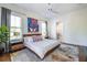 Bright bedroom with a modern ceiling fan, plush rug, ensuite access, and a private balcony at 1076 Manigault Se St, Atlanta, GA 30316