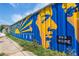 Vibrant community mural in Reynoldstown features bright colors and a message of 