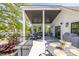 Spacious porch boasts an outdoor kitchen with a dining area and a seating area with comfortable furniture at 1076 Manigault Se St, Atlanta, GA 30316
