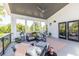 Inviting porch with a cozy seating area, ceiling fan, and access to the home's interior through double doors at 1076 Manigault Se St, Atlanta, GA 30316