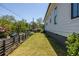 Expansive side yard featuring a lush lawn and modern fencing that enhances the property's appeal at 1076 Manigault Se St, Atlanta, GA 30316