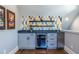 Wet bar with gray cabinets, beverage cooler, and colorful geometric accent wall at 1076 Manigault Se St, Atlanta, GA 30316