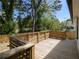 Wood deck surrounded by mature trees at 1189 Gardenia Nw St, Atlanta, GA 30314