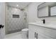 Bathroom featuring modern hardware, a tiled shower, and vanity at 1189 Gardenia Nw St, Atlanta, GA 30314