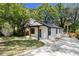 Stylish home showing front exterior, a long driveway, fresh lawn, and black window trim at 1189 Gardenia Nw St, Atlanta, GA 30314