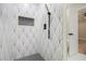 Stylish shower features geometric tile, a built-in niche, and modern hardware at 1189 Gardenia Nw St, Atlanta, GA 30314