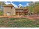 Expansive backyard with covered deck, screened porch, patio seating, and an outdoor fireplace at 20 Balfour Dr, Covington, GA 30014