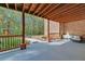 A backyard features a covered porch and patio, and manicured flower beds at 20 Balfour Dr, Covington, GA 30014