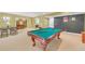 Basement featuring a pool table, dining table, and carpeted floors for a perfect entertainment space at 20 Balfour Dr, Covington, GA 30014