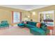 Finished basement featuring a plush sectional, accent chair, window, and opening to the pool table room at 20 Balfour Dr, Covington, GA 30014