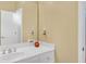 Bathroom featuring white vanity with dual sinks, large mirror, and neutral wall color at 20 Balfour Dr, Covington, GA 30014
