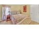 Bright bedroom with patterned bedding, curtains, and a bedside table and lamp at 20 Balfour Dr, Covington, GA 30014