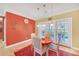 Cozy dining area with a round table, seating for four, and doors leading to the outside at 20 Balfour Dr, Covington, GA 30014