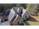 Aerial view showcasing the roof and surrounding landscape of the charming brick home at 20 Balfour Dr, Covington, GA 30014